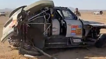 Watch as Dakar victory contender flips out of rally