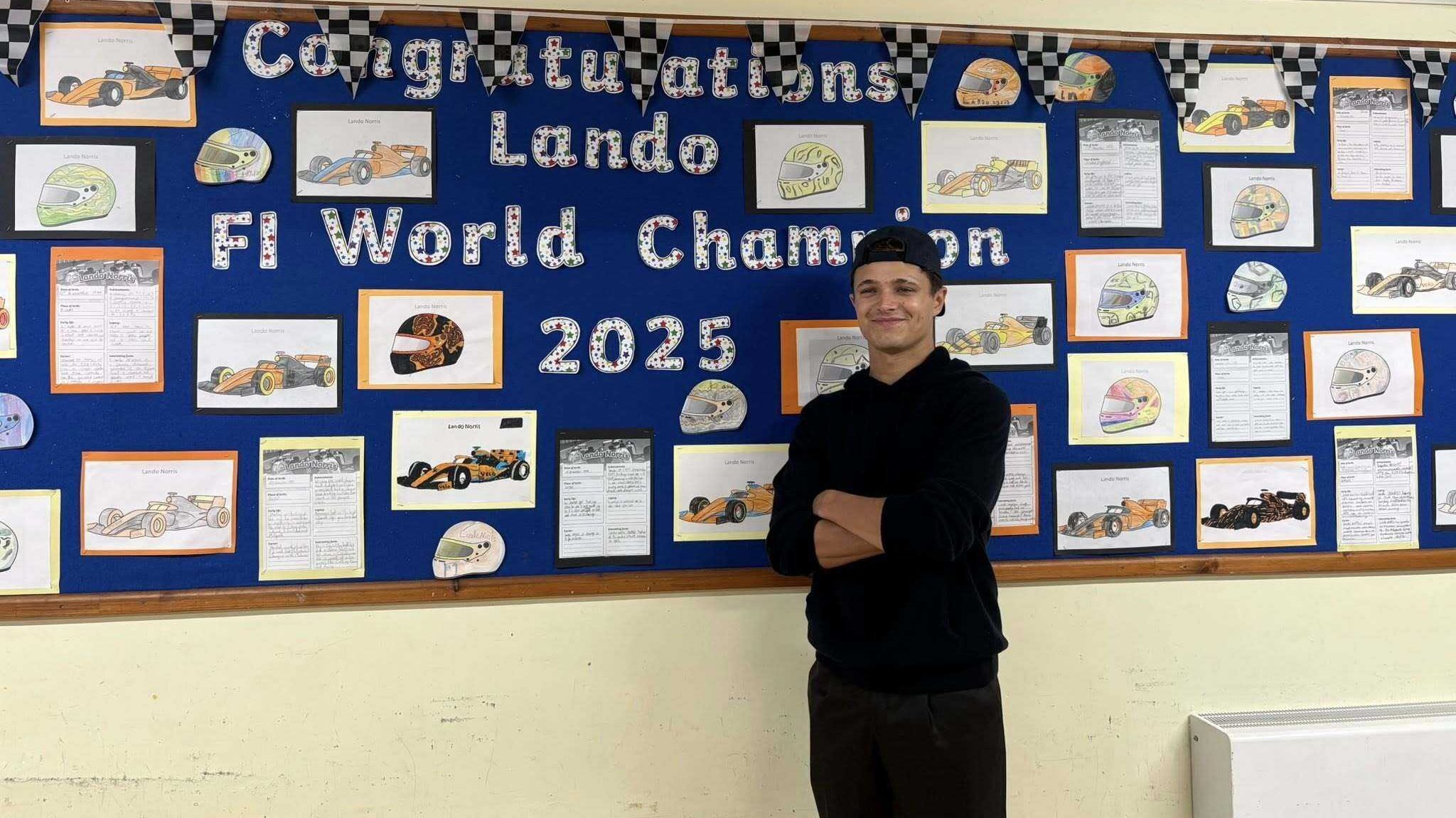 Norris visits old school