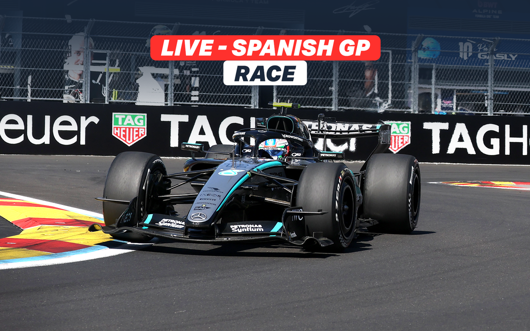 Lewis Hamilton walking through the pit lane during the 2026 Spanish Grand Prix in Madrid