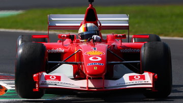 Sebastian Vettel makes Ferrari return in emotional outing