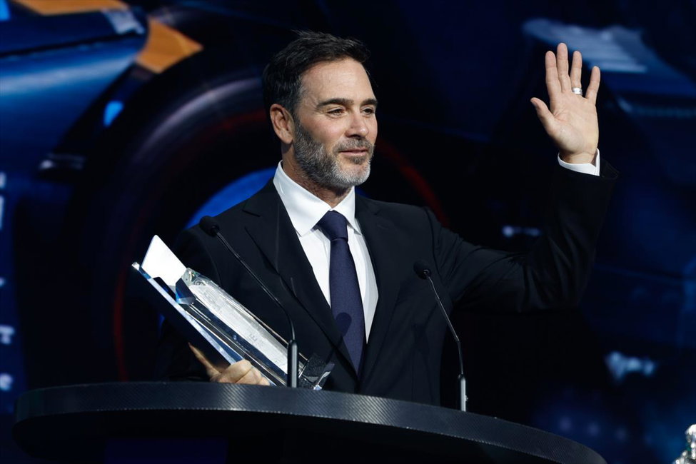 Jimmie Johnson receiving his Rookie of the Year trophy after the 2022 Indianapolis 500.