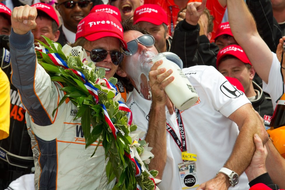 Dan Wheldon drinks milk after winning the Indianapolis 500.