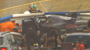 Porsche driver smashes through guardrail in heavy crash